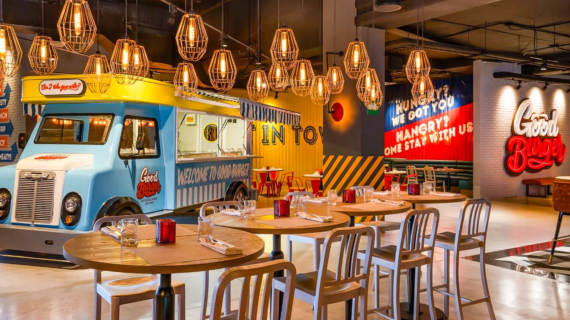 Good Burger restaurant at Nickelodeon Resort Cancun featuring retro food truck setup and neon signs.