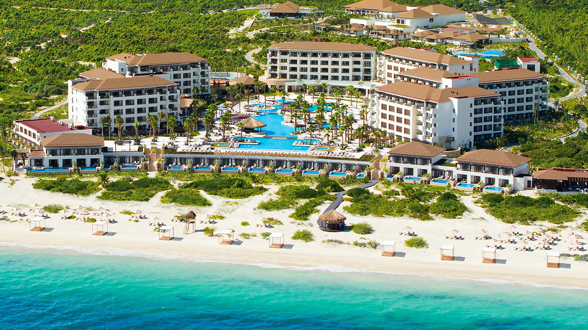 A look at pools, gardens, and beachfront layout in one frame.