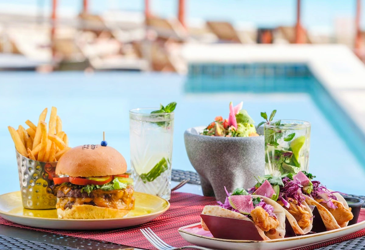 Gourmet burger, tacos, and cocktails by the pool at The Westin Cancun resort.