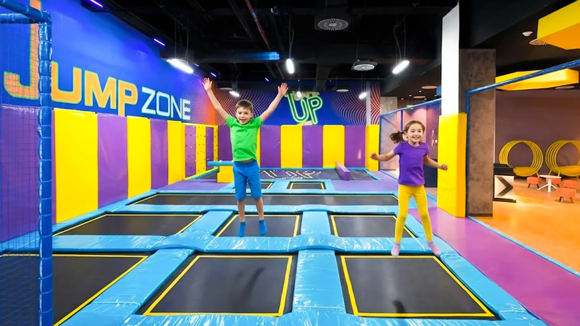 Children jumping on colorful trampolines at the Jump Zone indoor play area in Royalton Splash Riviera Cancun.
