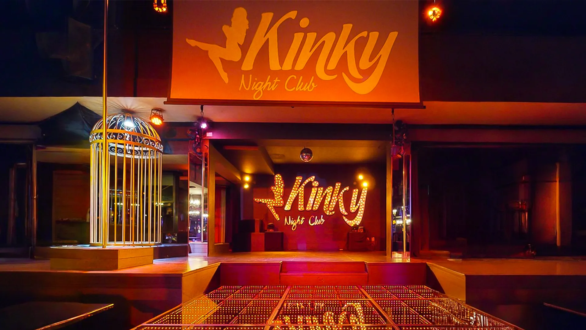 The neon lights of the Kinky Night Club at the Grand Oasis Cancun resort, showcasing a vibrant nightlife atmosphere.