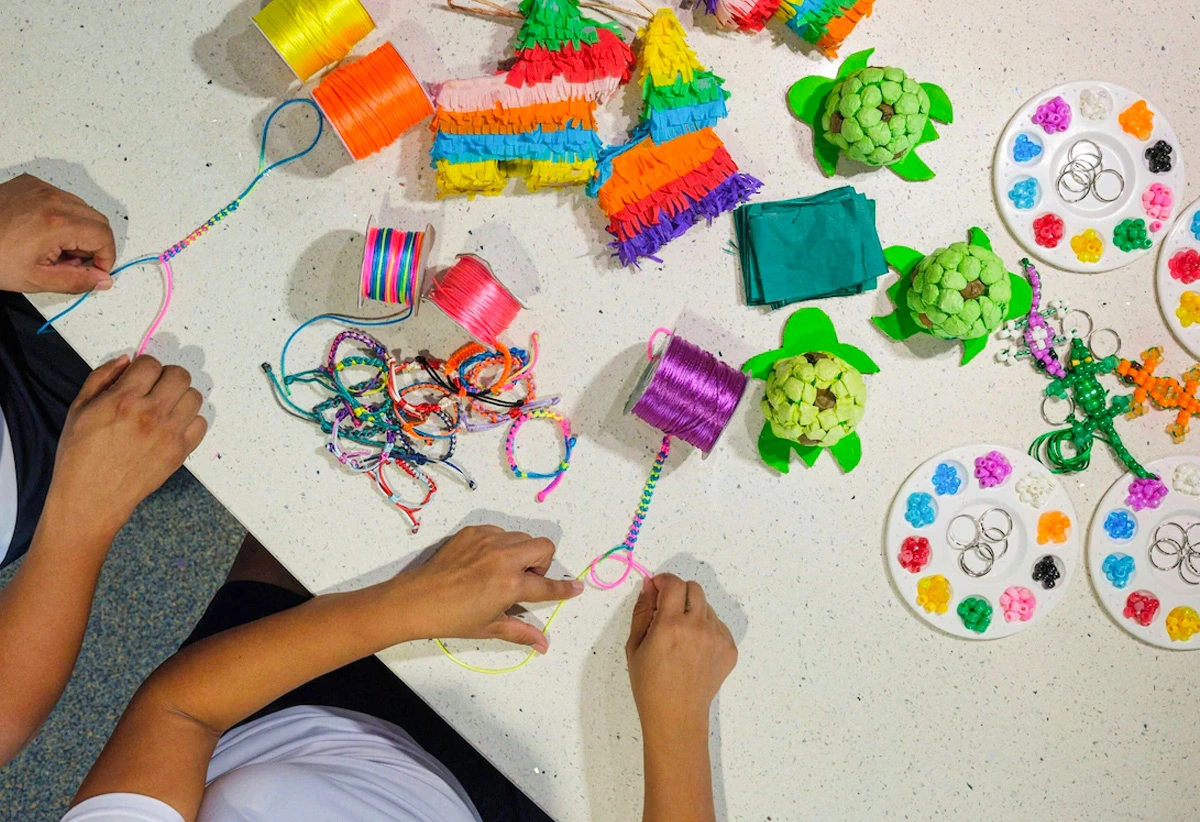 Colorful kids’ crafts and bracelet-making activity at The Westin Cancun family resort.