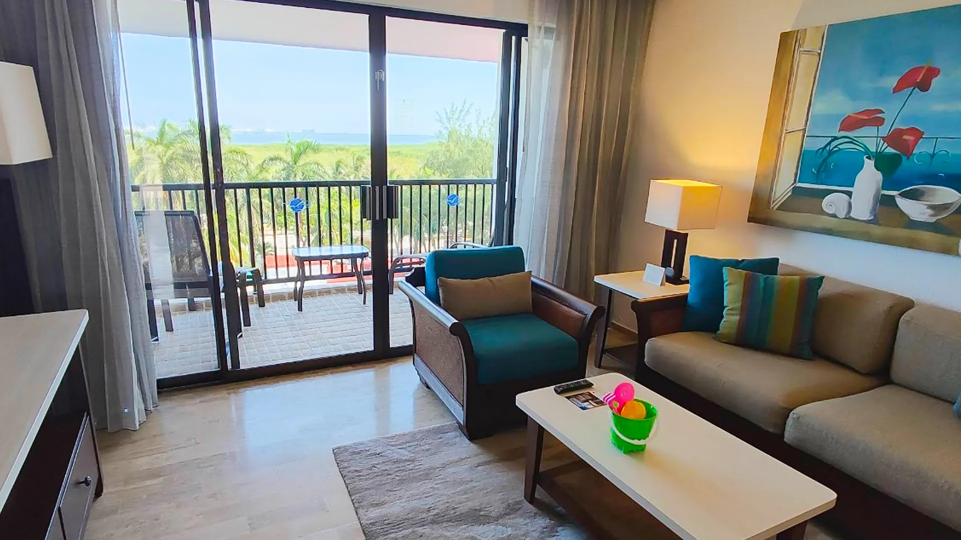 What is the difference between suites and villas at The Royal Cancun?