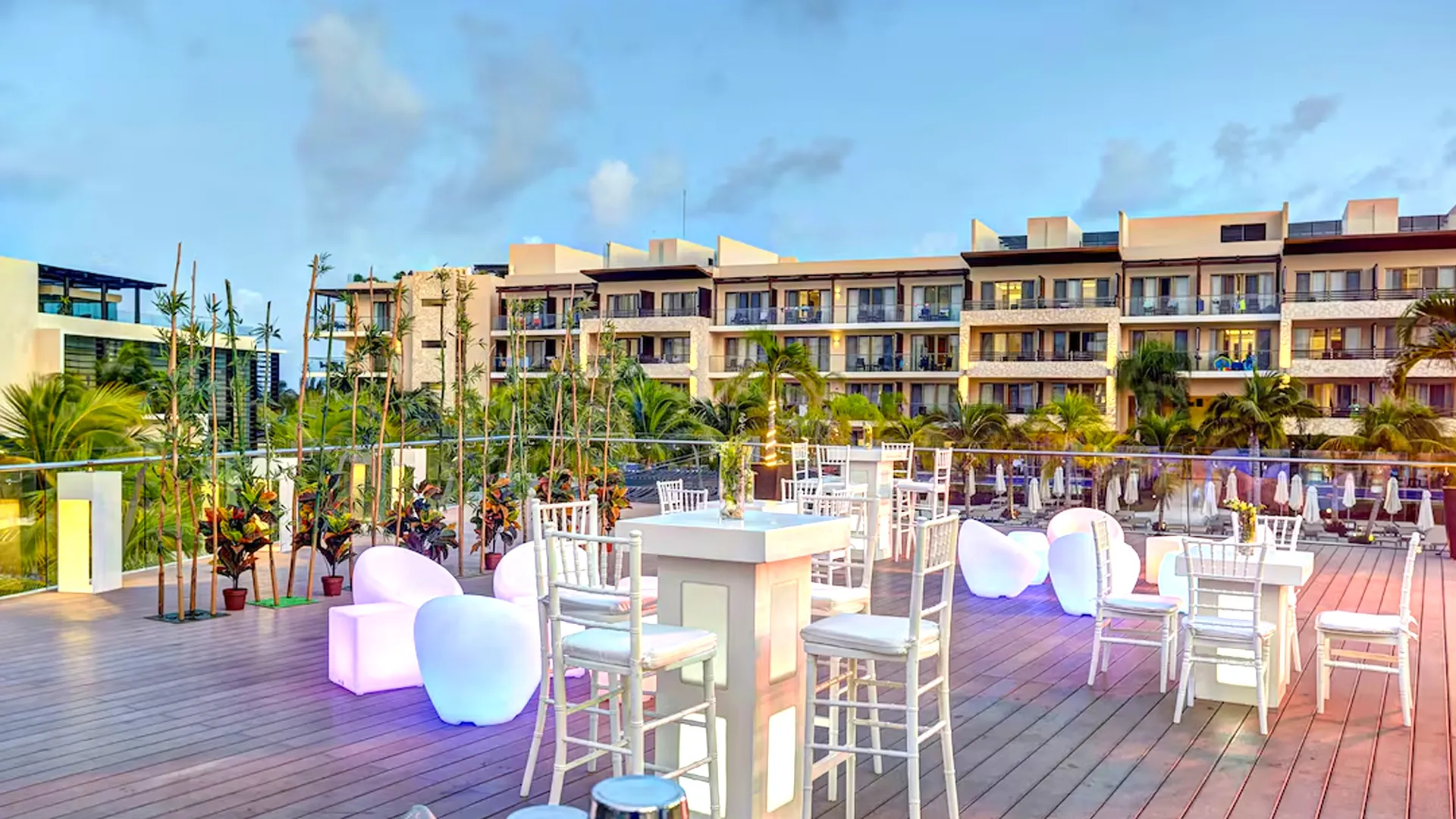 Elegant wedding reception setup with navy blue table décor on the oceanfront terrace at Royalton Cancun.