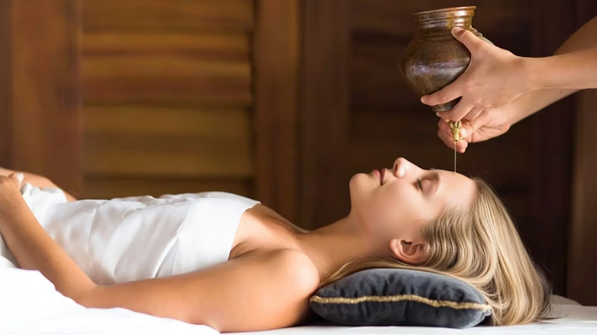 Woman receiving a relaxing Mayan-inspired oil therapy at Nizuc Spa by ESPA.