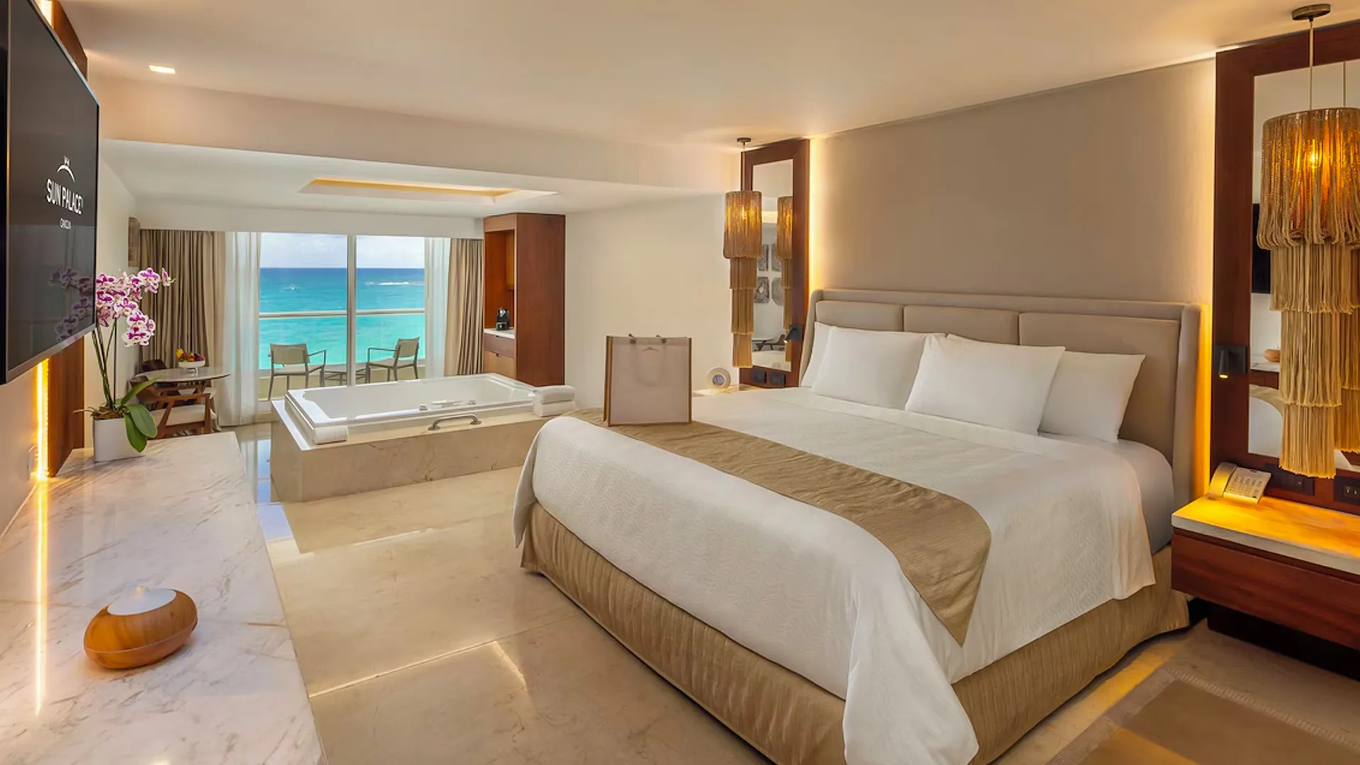 A luxurious room at Sun Palace Cancun with a view of the ocean.