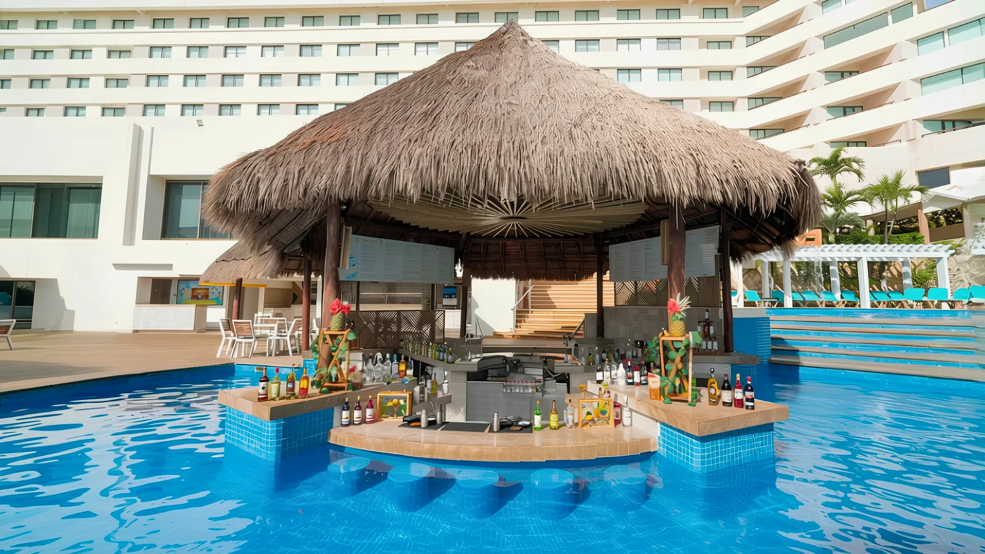 Swim-up bar at Royal Solaris Cancun with thatched roof, full bar setup, colorful bottles, and a pool surrounding the bar.