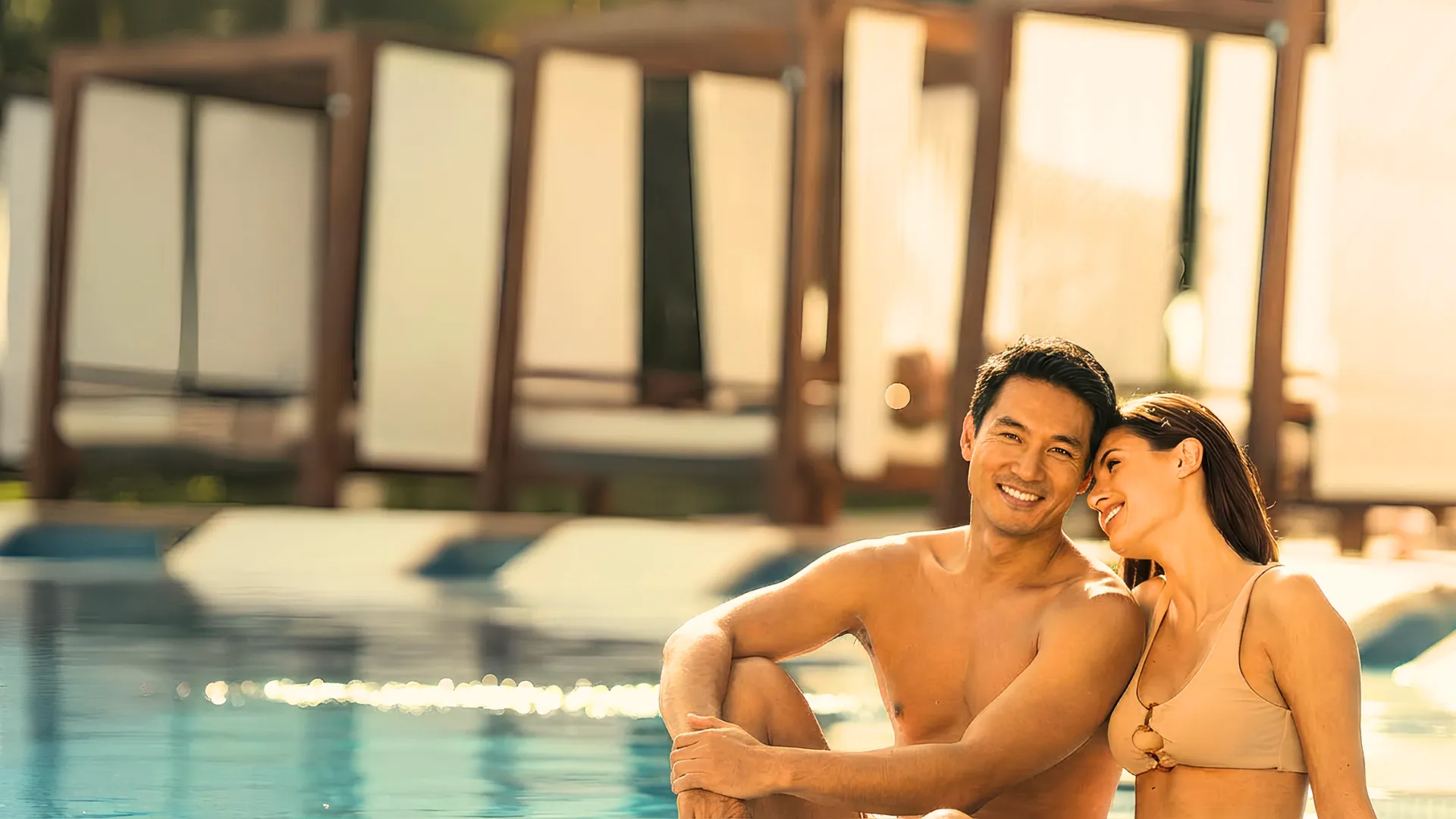 Romantic couple relaxing by the pool at Azul Beach Resort Riviera Cancun.