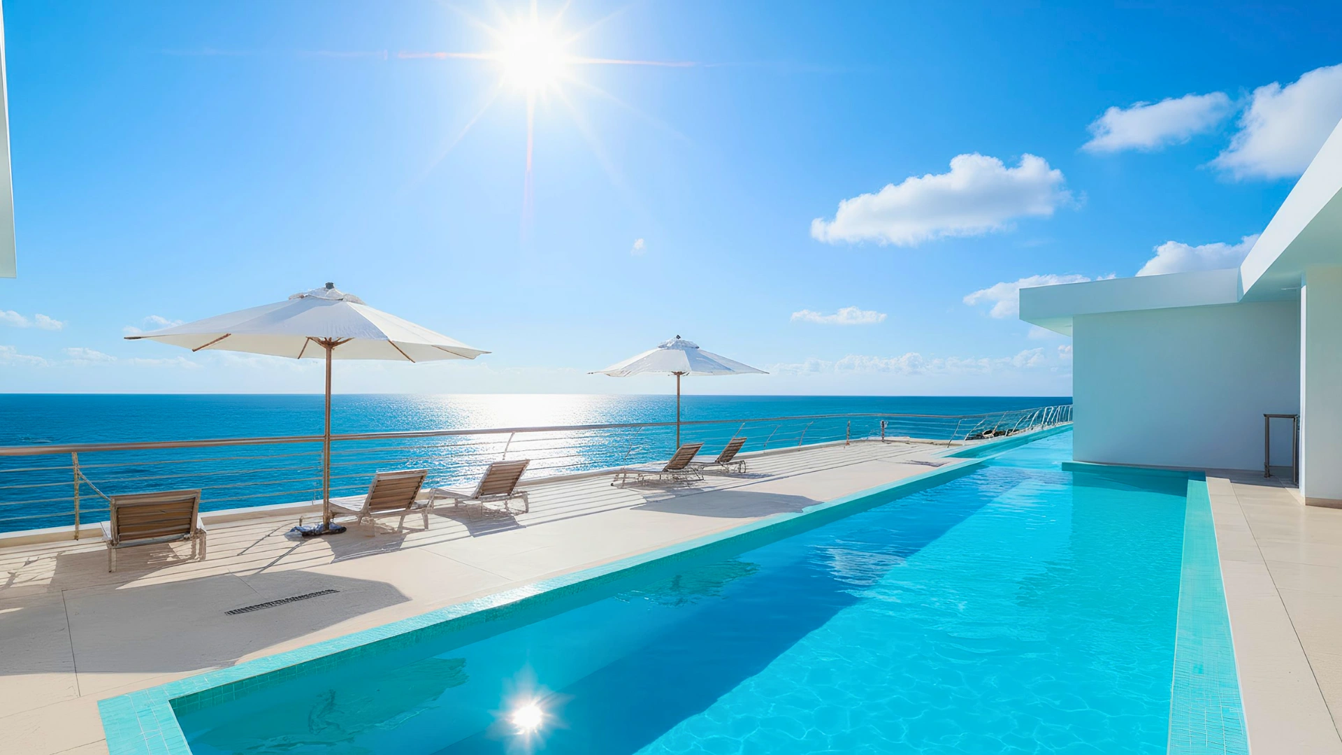 Infinity pool overlooking the Caribbean Sea at Nickelodeon Riviera Maya under bright tropical sun.