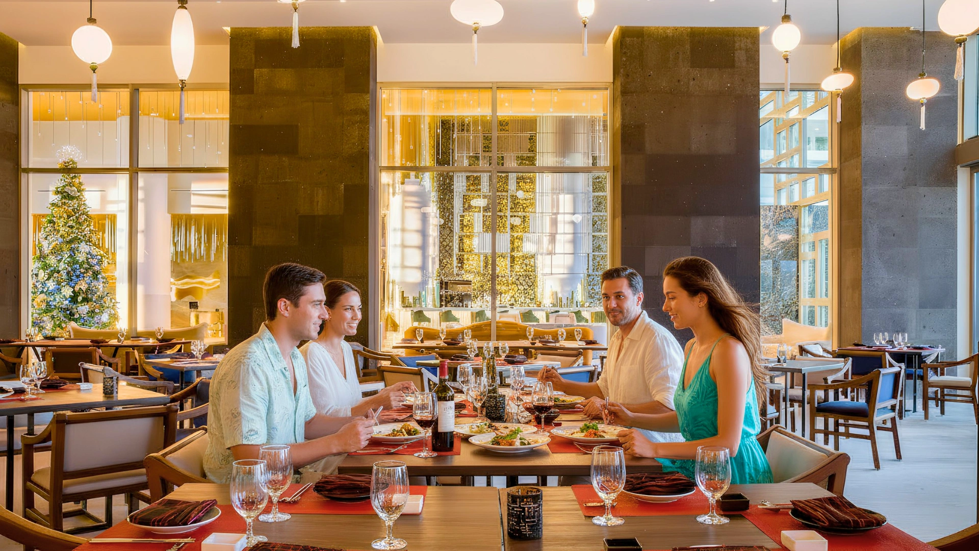 A family enjoys a fine dining experience at one of Garza Blanca Cancun's restaurants, with a warm and inviting ambiance.
