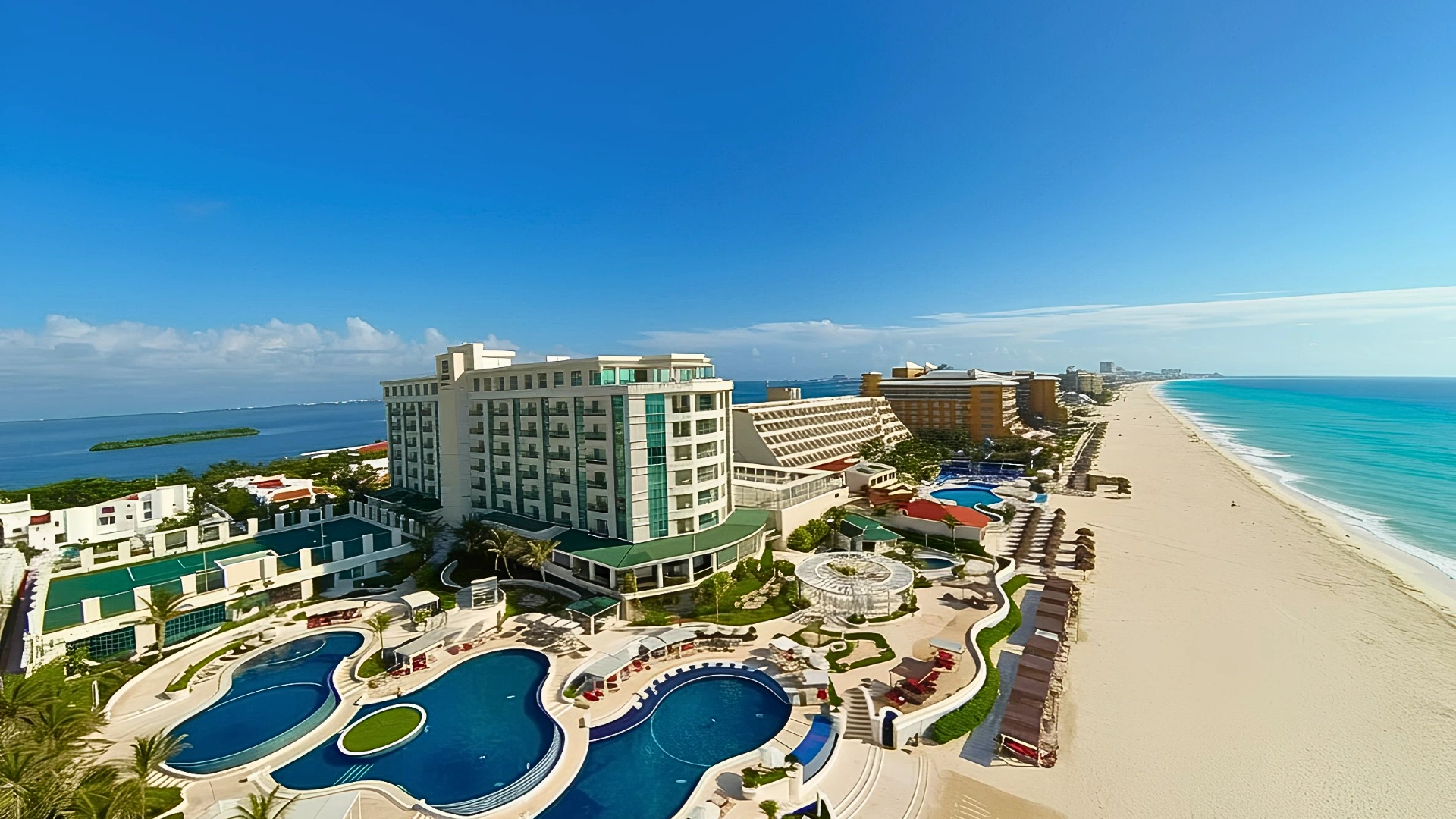 Aerial of Sandos Cancun with multiple pools, beach, and full resort layout.