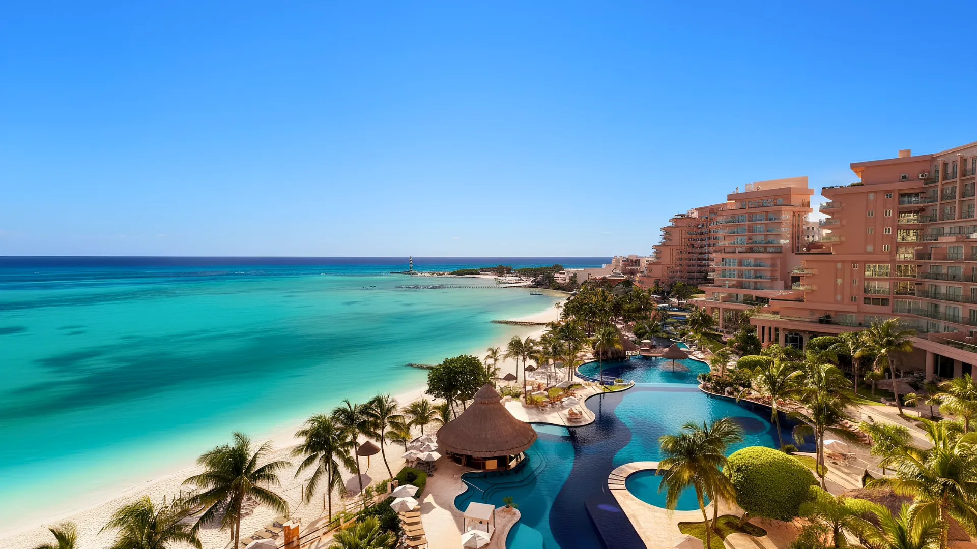 Aerial view of the beachfront pool and turquoise Caribbean Sea at Grand Fiesta Americana Coral Beach Cancun.