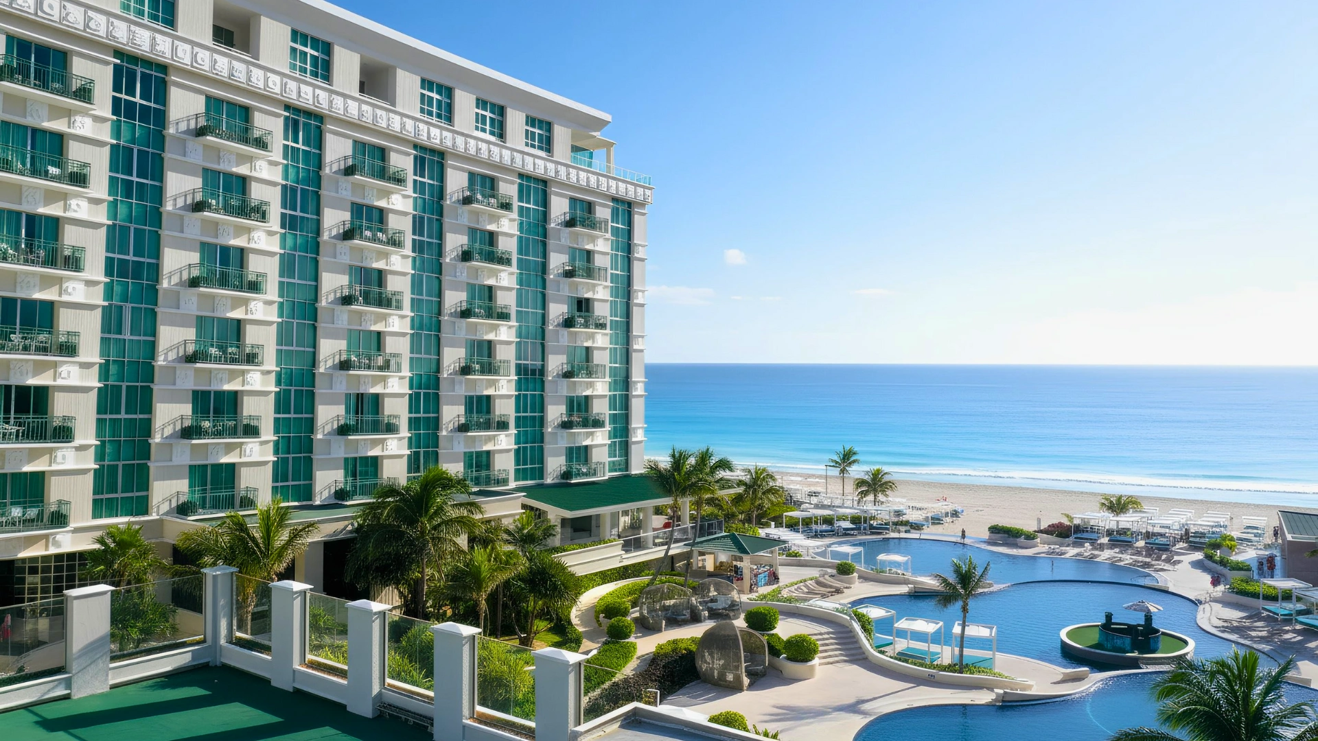 View of Sandos Cancun with an outdoor pool and beautiful Caribbean beach, located in Cancun's Hotel Zone.