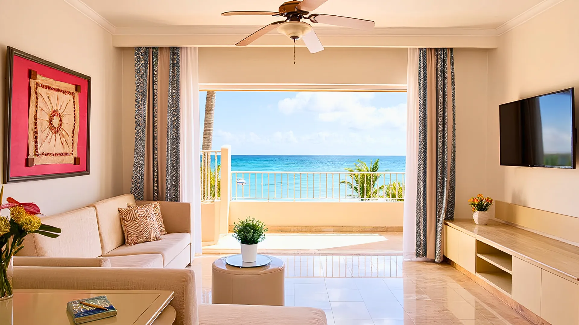  A luxurious hotel room at Excellence Cancun, featuring modern decor with a spacious layout and a view of the ocean. 