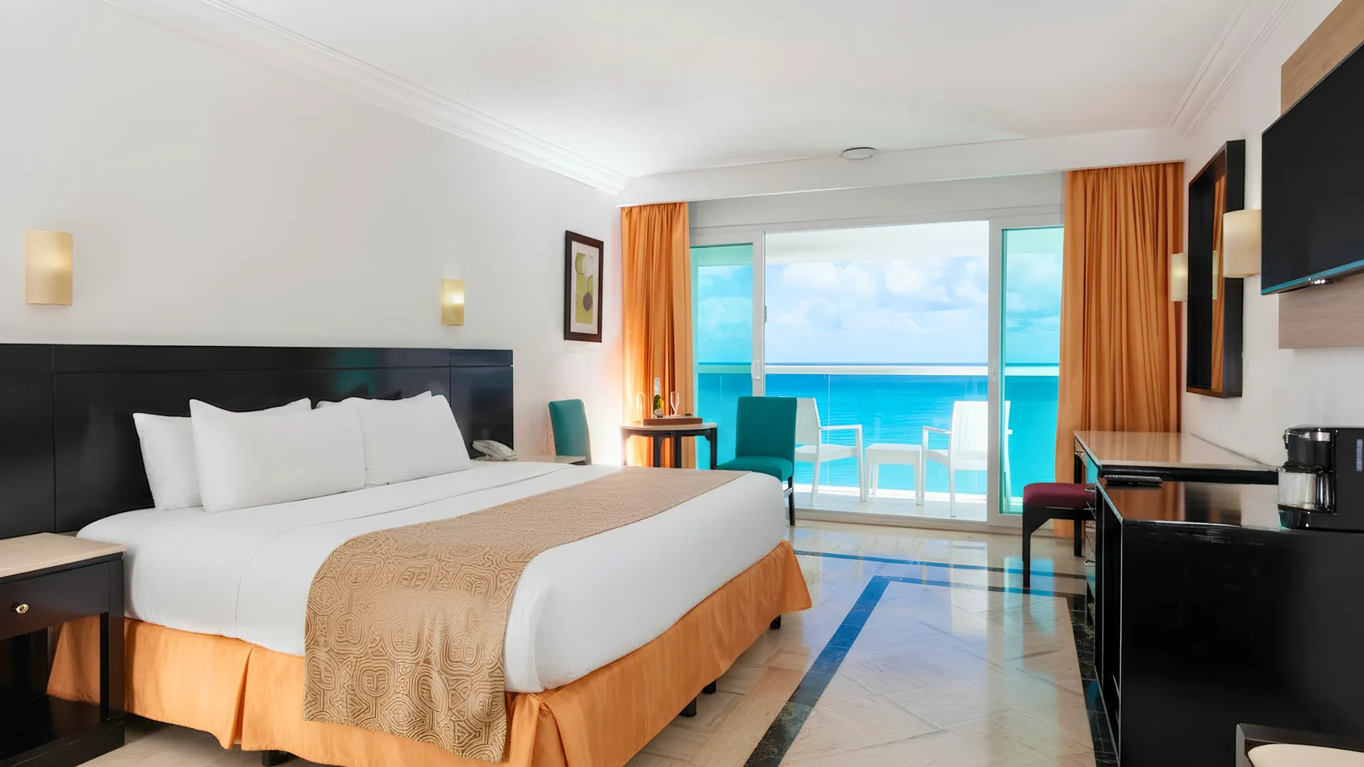 Krystal Cancun room with a view of the beach and modern decor.