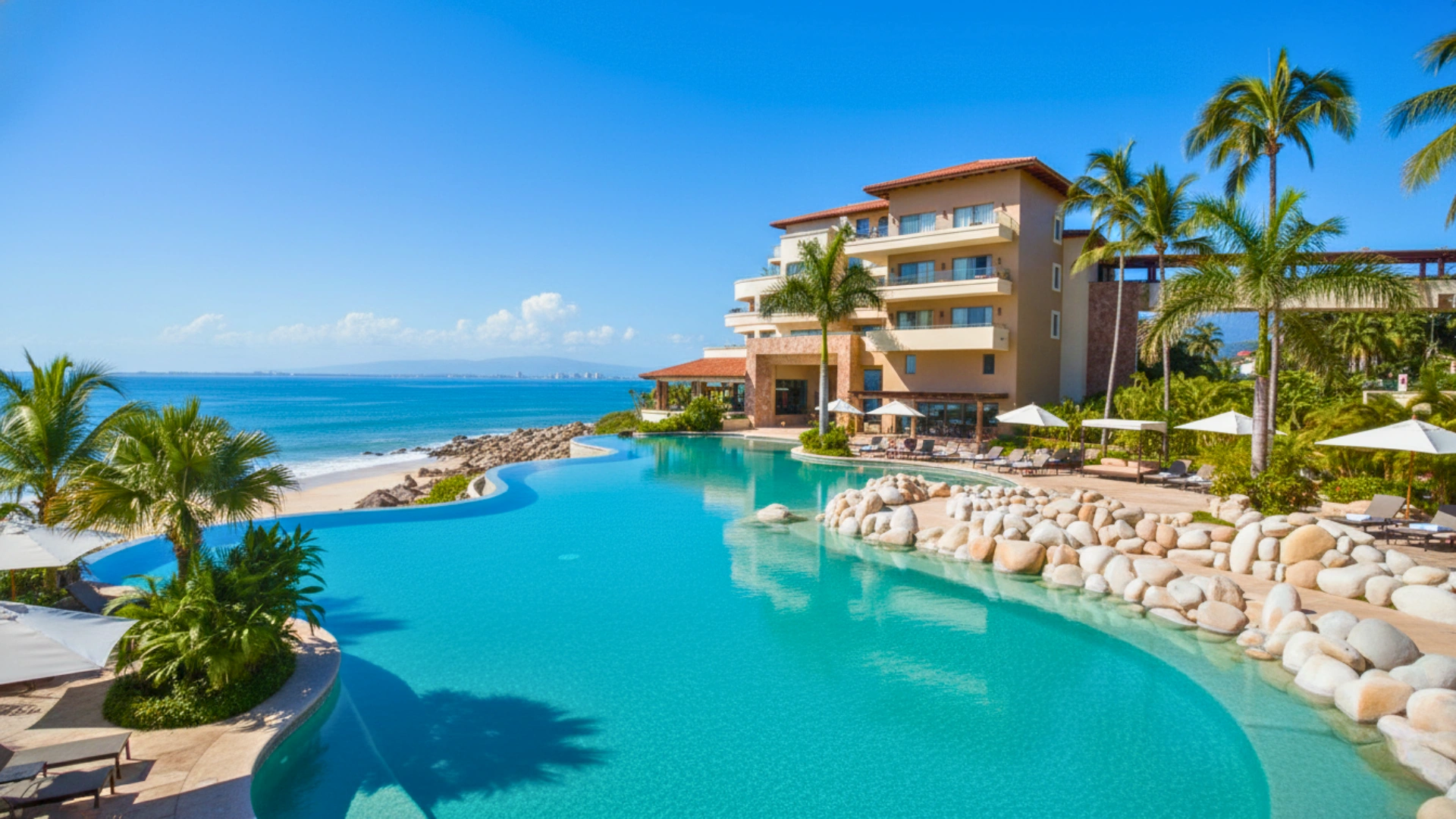 The infinity pool at Garza Blanca Cancun overlooking the beach, with vibrant palm trees and crystal-clear waters.