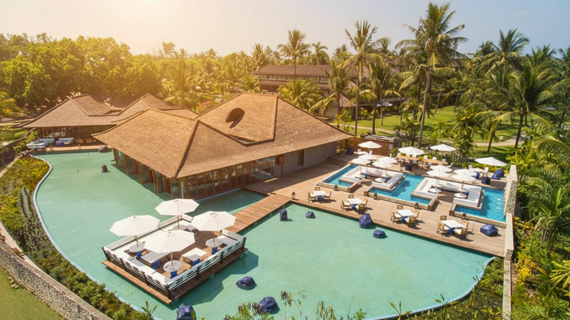 Aerial view of the sprawling pool area and pristine beach at Club Med Cancun, offering a luxury vacation experience.