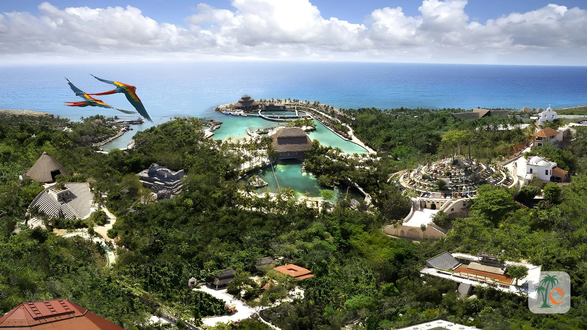 A breathtaking aerial view of a luxurious resort set amidst lush greenery, with pools and structures scattered across the landscape, overlooking the vibrant blue ocean.